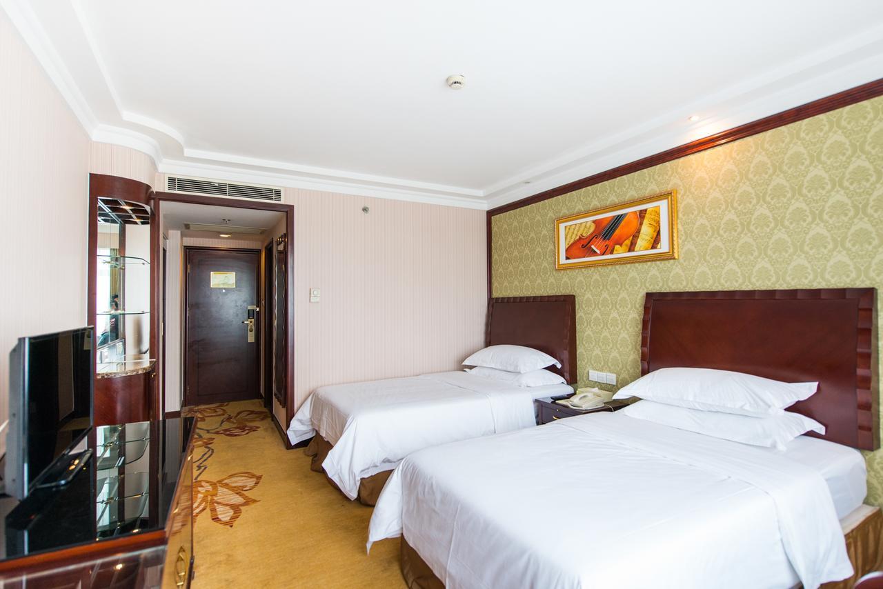Vienna International Hotel Shanghai Train Station Bagian luar foto